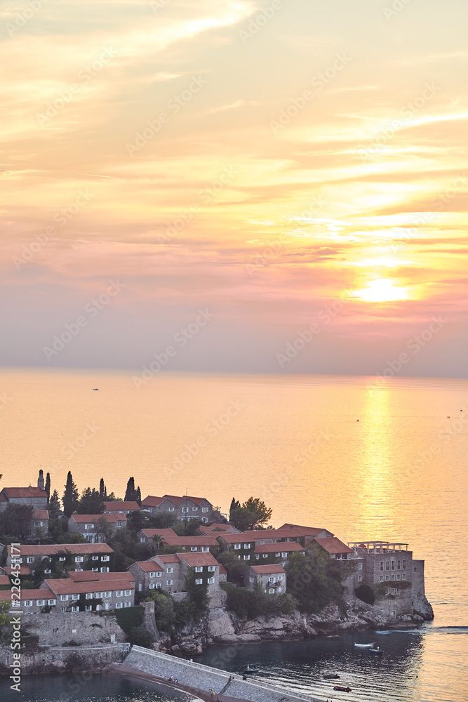 The island of Sveti Stefan. The Resort Of Montenegro. Sunset on the island of Sveti Stefan.