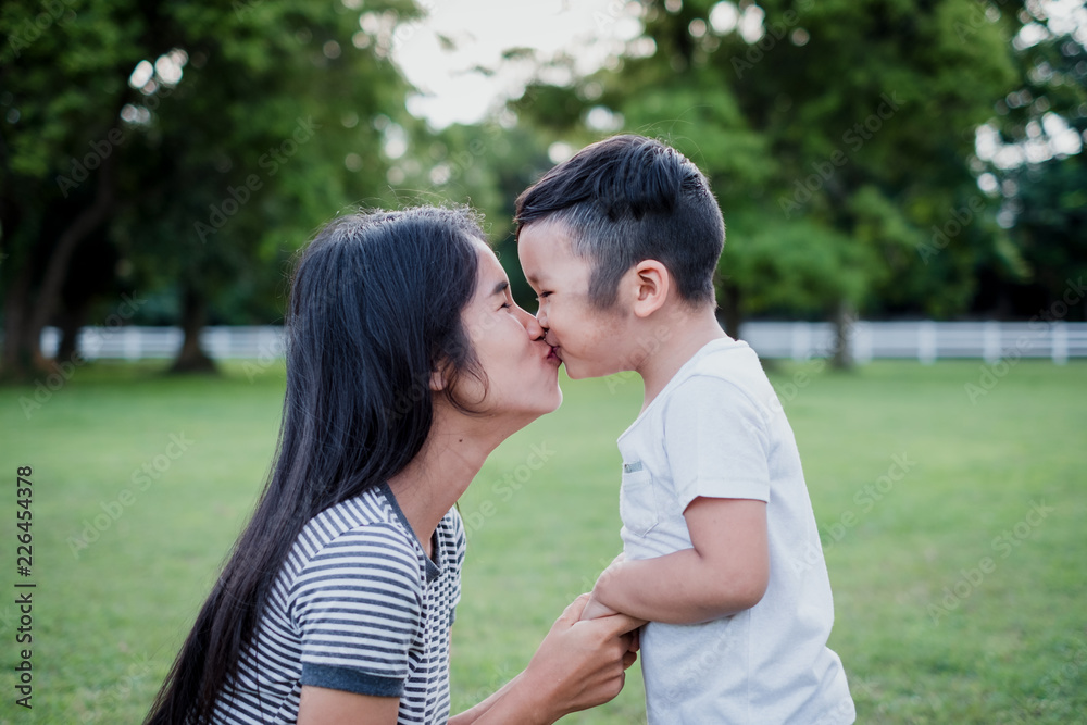 Happy loving family. mother and child boy playing, kissing and Hold hands. Happy loving family. mother and child boy playing, kissing and Hold hands.