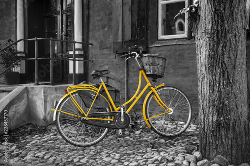 Yellow bike on B/W back