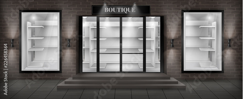 Vector concept background, boutique shop facade with signboard. Storefront with brick wall, entrance with large glass door and empty illuminated showcases with white shelves, realistic illustration