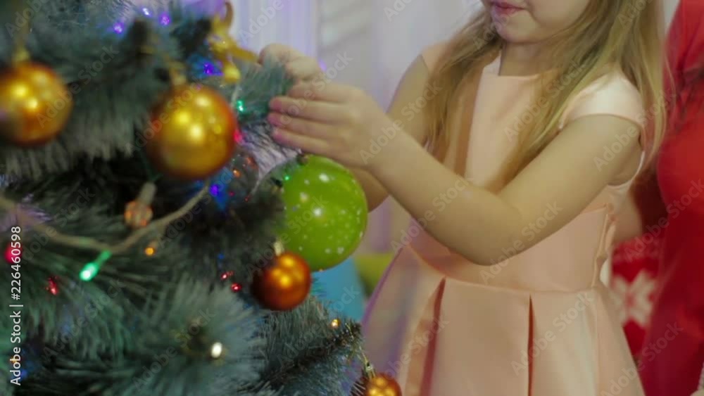 A family decorating their Christmas tree A family decorating their Christmas tree