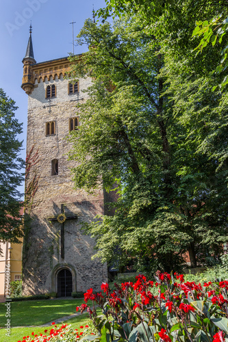 Church tower and red flowers in Warendorf, Germany