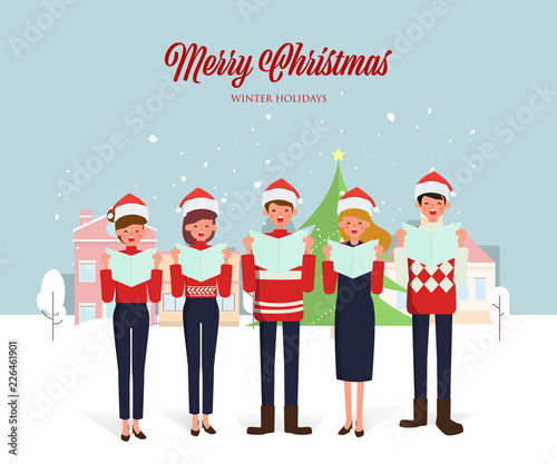 Christmas Caroling. Teenage choir singing carols merry christmas greeting on city background with snow.