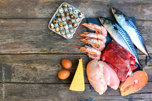 Fotografija Healthy food of animal origin on old wooden background