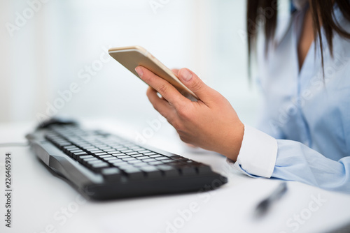 Businesswoman using her cell phone