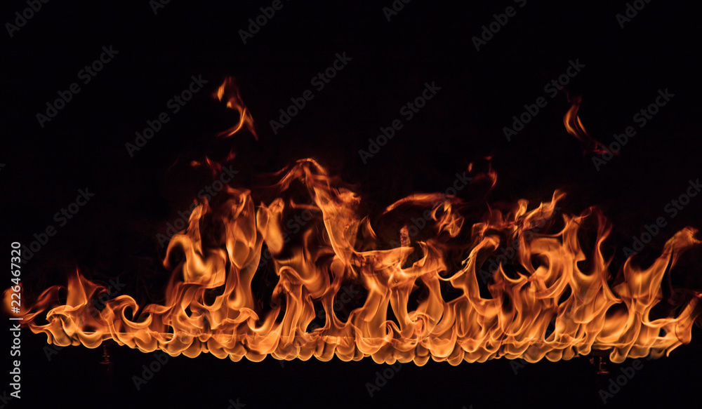 Texture of fire on a black background. - obrazy, fototapety, plakaty 