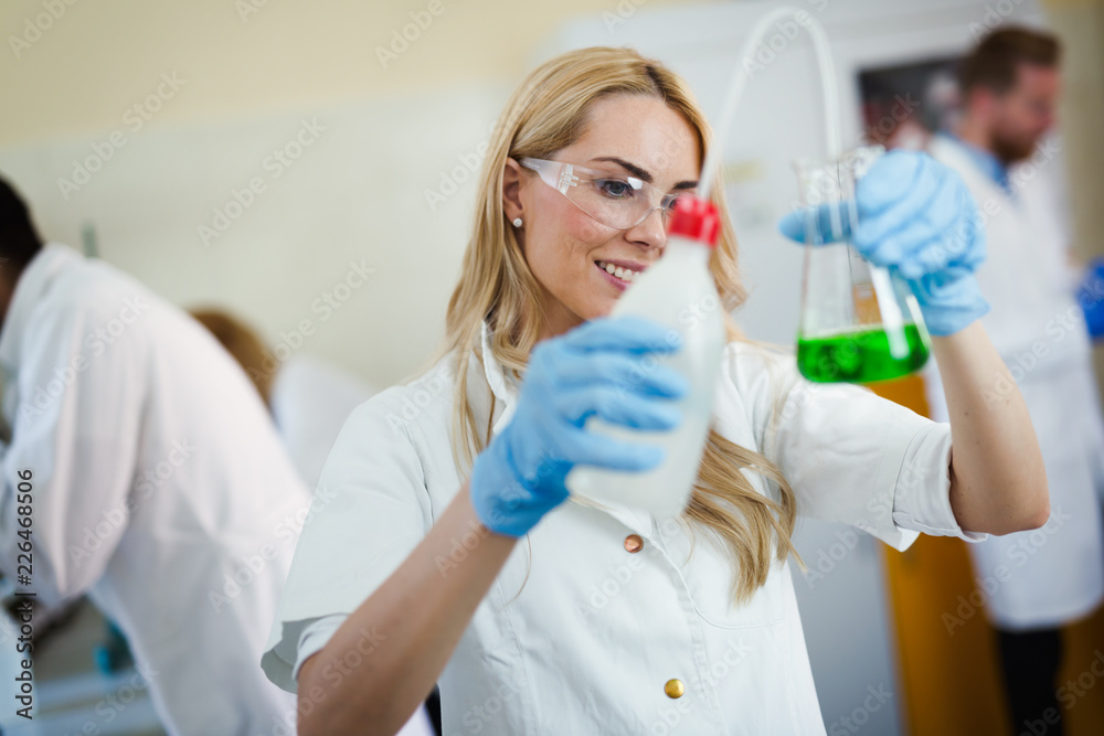 Group of students working at the laboratory Group of students working at the laboratory