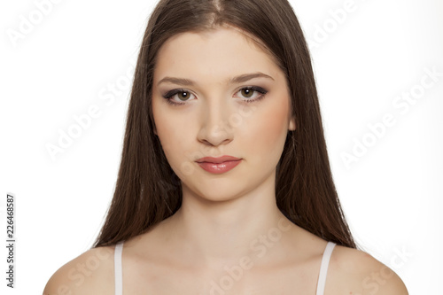 Portrait of young beautiful woman with makeup on white backgeound