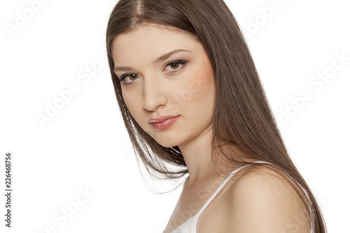 Portrait of young beautiful woman with makeup on white backgeound