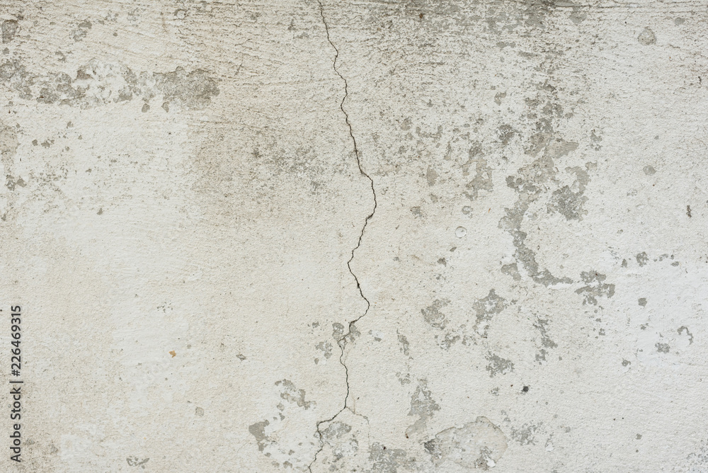 Wall fragment with scratches and cracks. It can be used as a background Wall fragment with scratches and cracks. It can be used as a background
