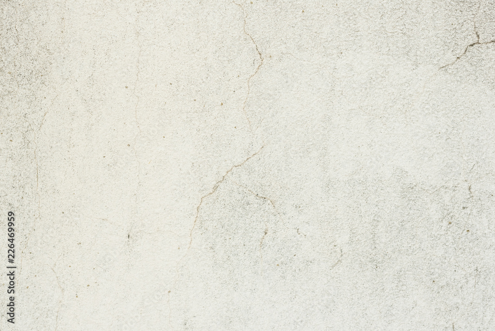 Fototapeta premium Wall fragment with scratches and cracks. It can be used as a background
