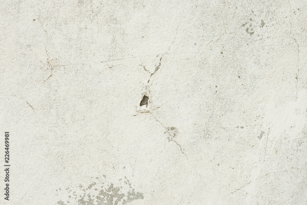Wall fragment with scratches and cracks. It can be used as a background Wall fragment with scratches and cracks. It can be used as a background