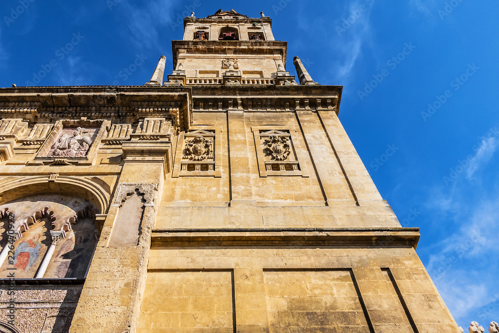 Fototapeta premium Bell tower of Mosque-Cathedral of Cordoba (Mezquita-Catedral de Cordoba), also known as Great Mosque (from 785) of Cordoba or Mezquita, monuments of Moorish architecture. Andalusia, Cordoba, Spain.
