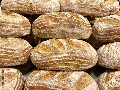 Loaves of white Sourdough bread piled high