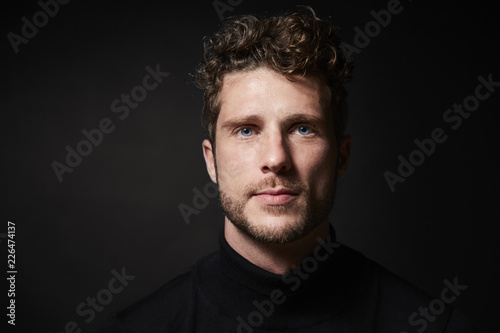 Stubble guy in studio, portrait