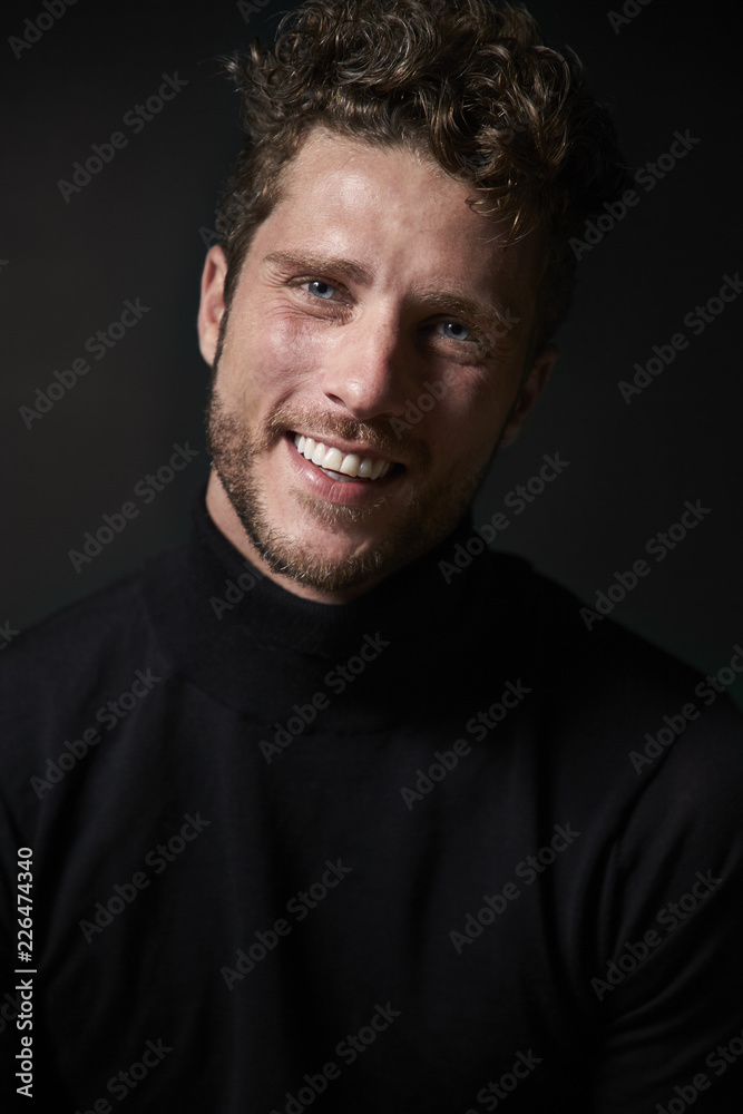 Happy guy in black top in studio Happy guy in black top in studio