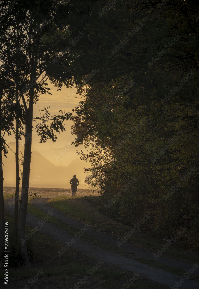 Man running silhouette at sunrise