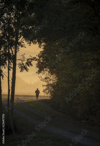 Man running silhouette at sunrise