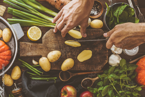 Wallpaper Mural Man preparing healthy dinner cooking process Torontodigital.ca
