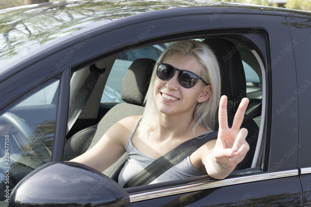 Young girl driving a car