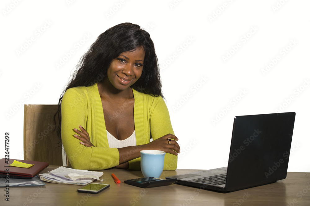 young happy and attractive black Afro American business woman smiling cheerful and confident working at office computer desk relaxed as successful businesswoman young happy and attractive black Afro American business woman smiling cheerful and confident working at office computer desk relaxed as successful businesswoman