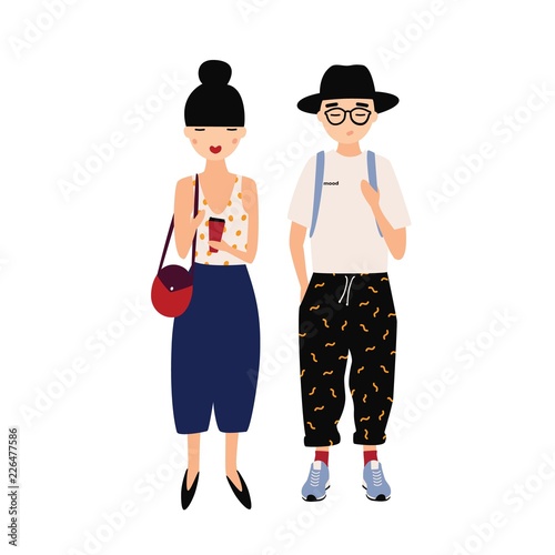 Funny hipster man and woman wearing stylish fancy clothing standing together....
