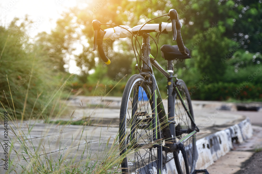 Fototapeta premium Sport Bicycle parked on street city park on morning.
