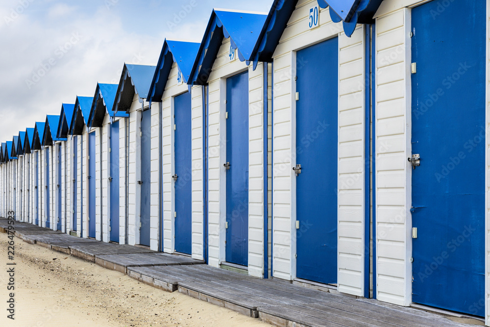 Naklejka premium Row of beach cabins in France
