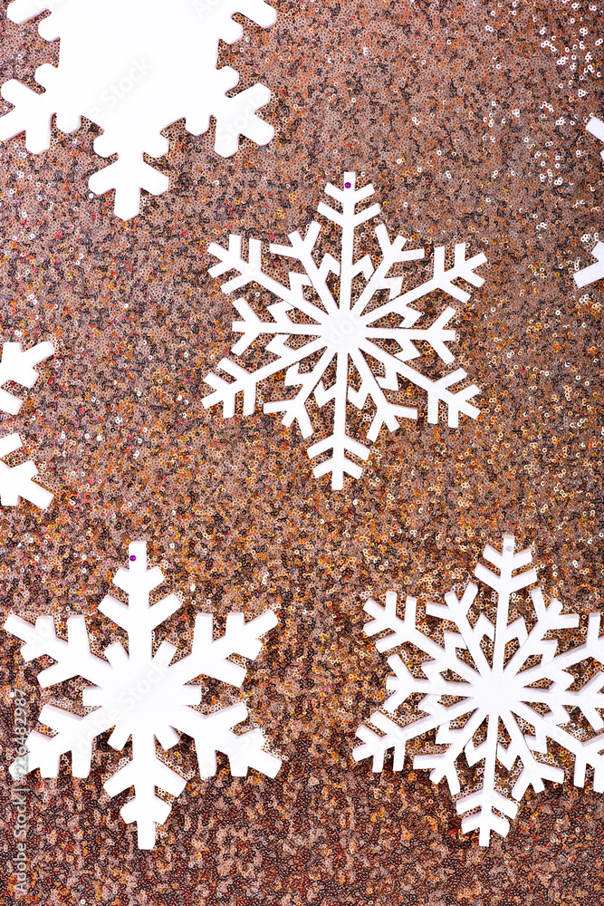 Snowflakes on shimmering festive background. Snowy background concept. Winter theme background with white snowflakes. Snowflakes on glitter shining surface Snowflakes on shimmering festive background. Snowy background concept. Winter theme background with white snowflakes. Snowflakes on glitter shining surface