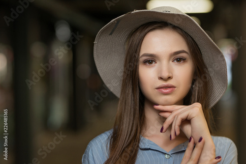 Portrait of a beautiful girl in a hat