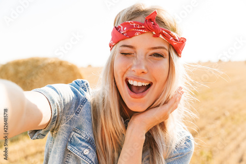 Beautiful smiling young blonde girl in headband