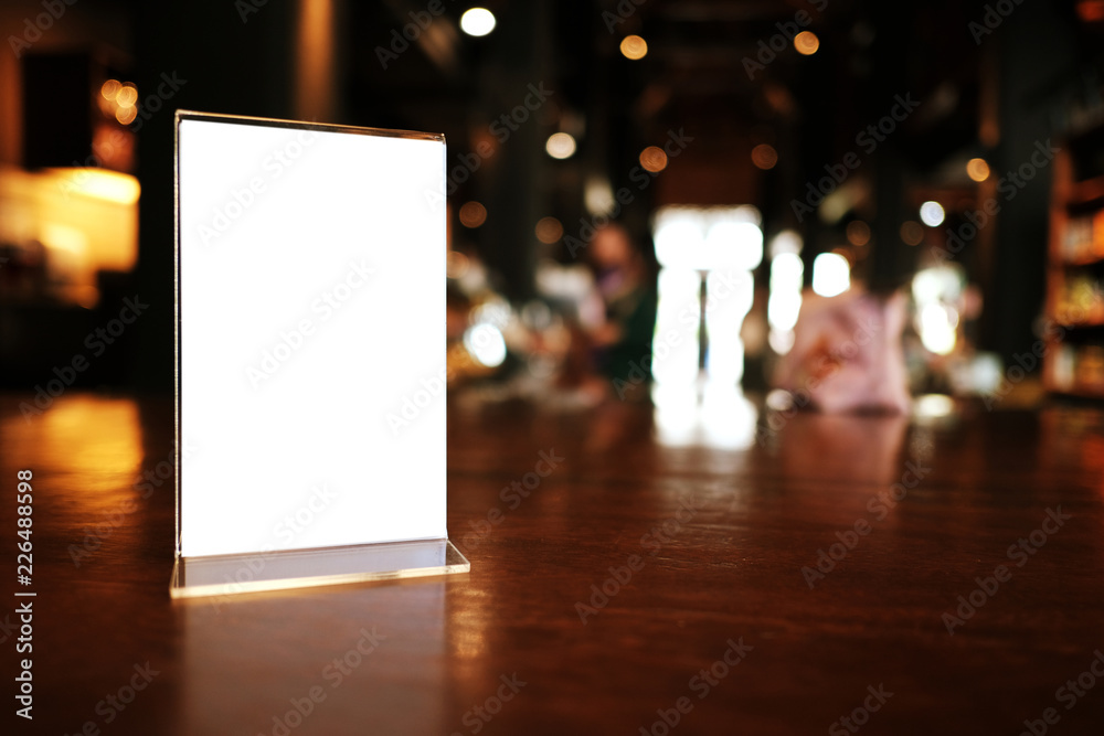 Menu frame standing on wood table in Bar restaurant cafe. space for text marketing promotion. Menu frame standing on wood table in Bar restaurant cafe. space for text marketing promotion.