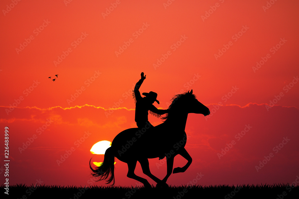 Rodeo cowboy at sunset Rodeo cowboy at sunset