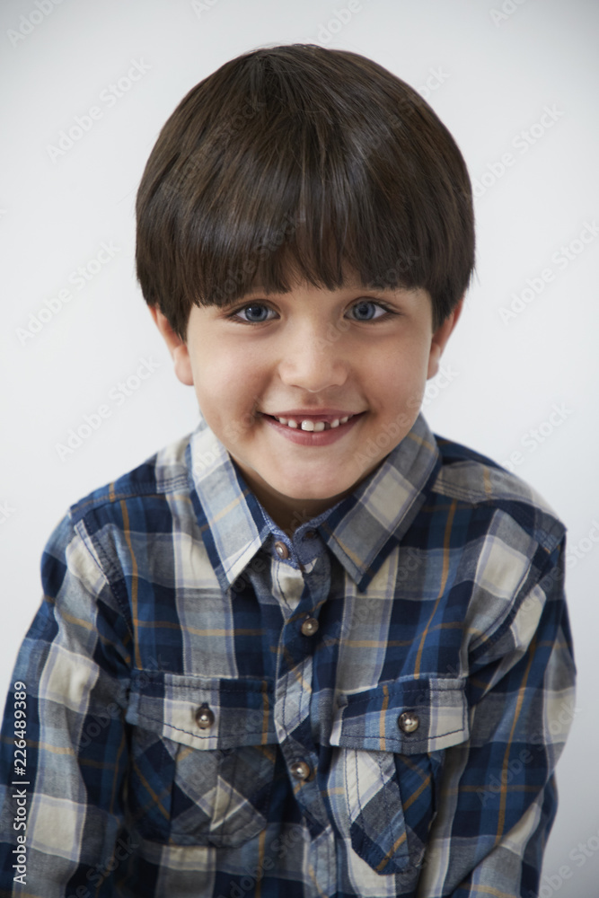 Smiling boy in blue, checked shirt, portrait Smiling boy in blue, checked shirt, portrait