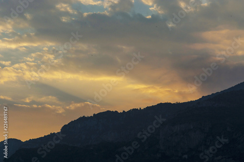 Stunning cloudy pink and white sky over Monaco at sunset in summer