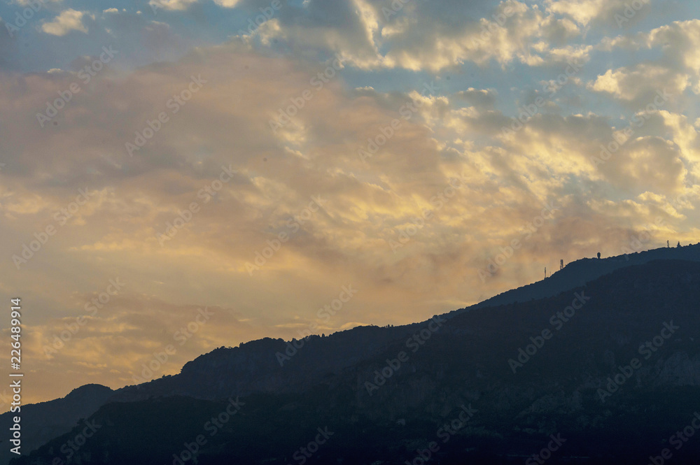 Fototapeta premium Stunning cloudy pink and white sky over Monaco at sunset in summer