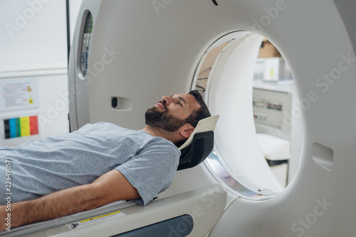 Patient Lying on the CT Scanner Bed photo