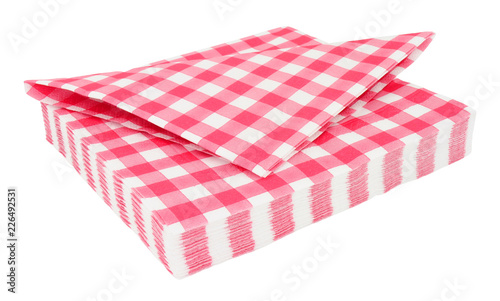 Red gingham pattern paper napkins isolated on a white background © philip kinsey