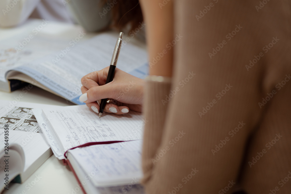 woman writing in notebook