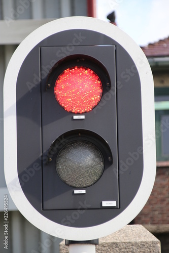 Red sign for an open Bridge at the Parksluis sluice which connects the Oude Maas river to the Rijn Schie canal in the Harbor of Rotterdam photo