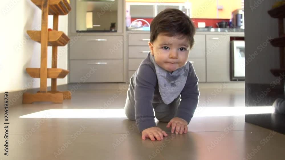 Adorable baby boy funny crawls in the floor Adorable baby boy funny crawls in the floor