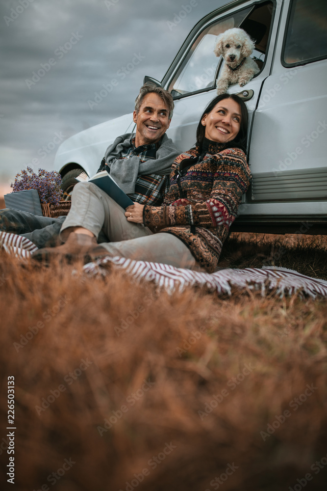 Fototapeta premium Adorable Couple and dog