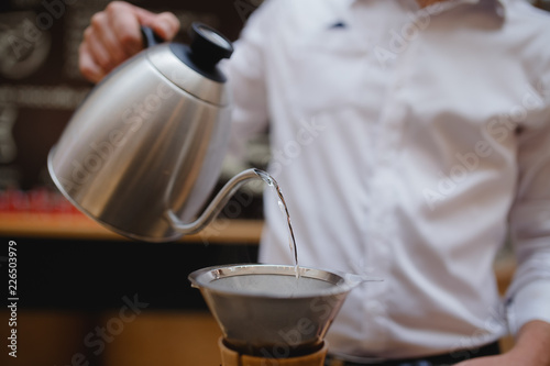 Barista man Making coffee in airpress service. photo