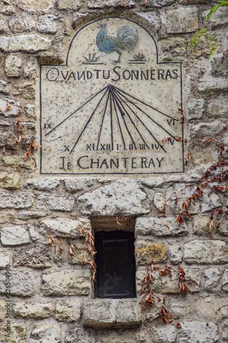 View of old sundial in a street of Montmartre, Paris, France