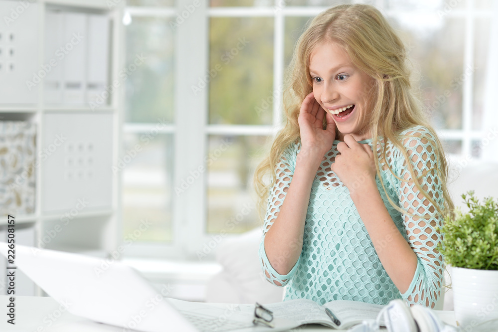 Portrait of surprised girl looking at laptop Portrait of surprised girl looking at laptop