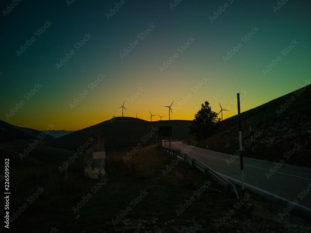 sunset on wind turbines