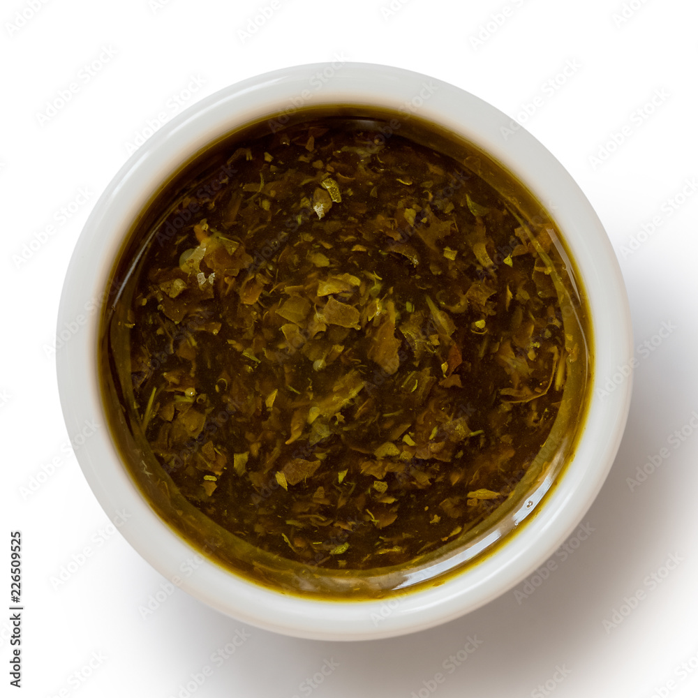 Mint sauce in white ceramic condiment bowl isolated on white from above. Mint sauce in white ceramic condiment bowl isolated on white from above.