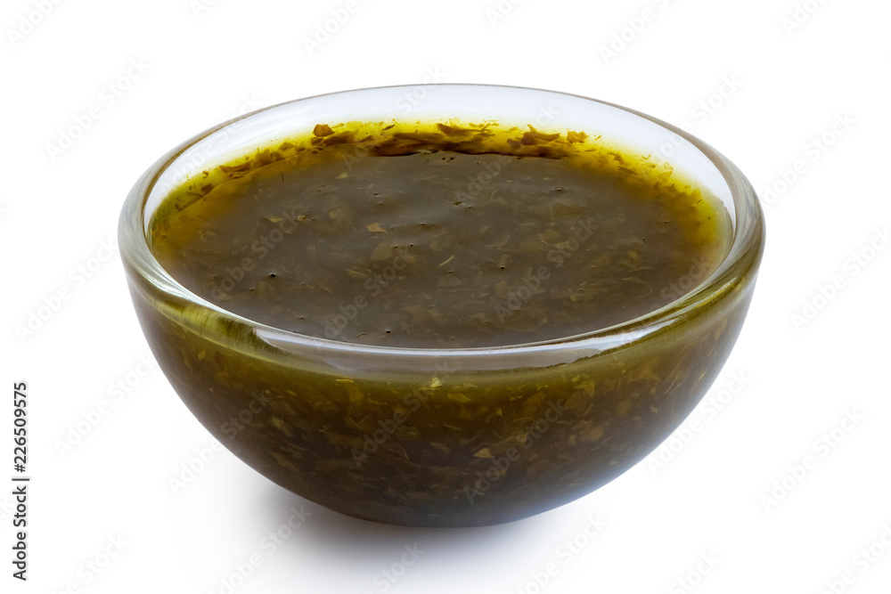 Mint sauce in glass condiment bowl isolated on white. Mint sauce in glass condiment bowl isolated on white.