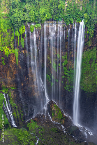 Majestic view of Tumpak Sewu Waterfall or also known as Coban Sewu  is a waterfall with 120 metres high  located in Sidomulyo Village  Pronojiwo District  Lumajang Regency  East Java  Indonesia.