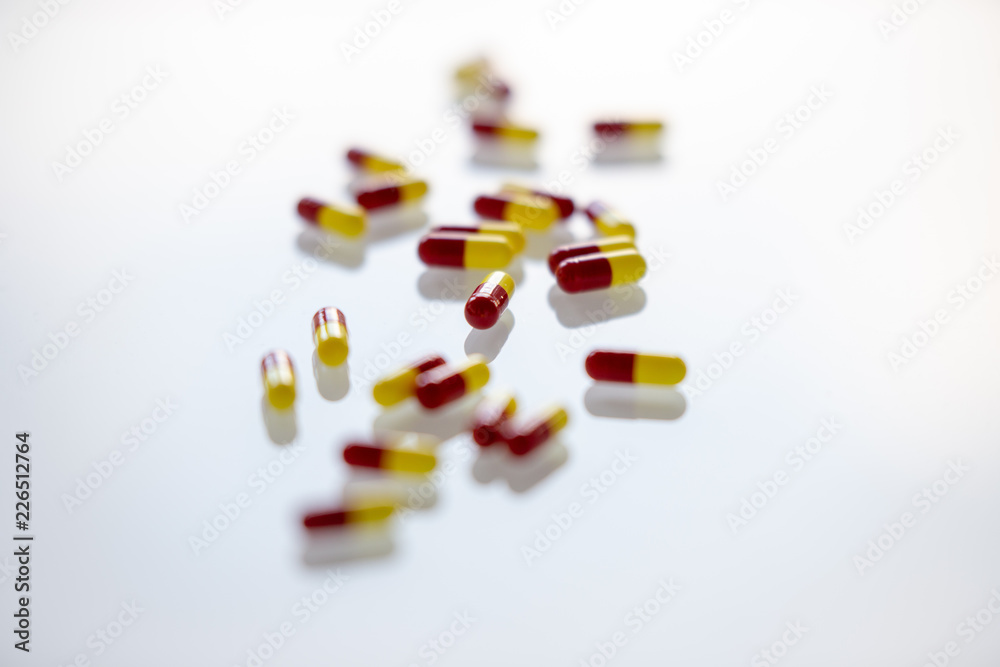 Close-up of colourful medication pills on a white background Close-up of colourful medication pills on a white background